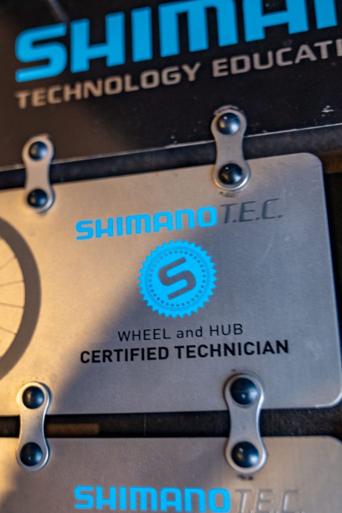 A certification plaque from Shimano reading "Wheel and Hub, Certified Technician"